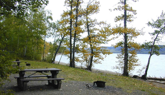 A view of a picnic bench close to the shore at Spencer Tuck Park